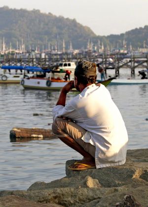 Muslim Man at Labuan Bajo Waterfront 